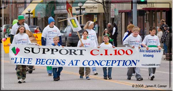 Supporters of CI 100 march in Kalispell's St. Patrick's Day parade.
